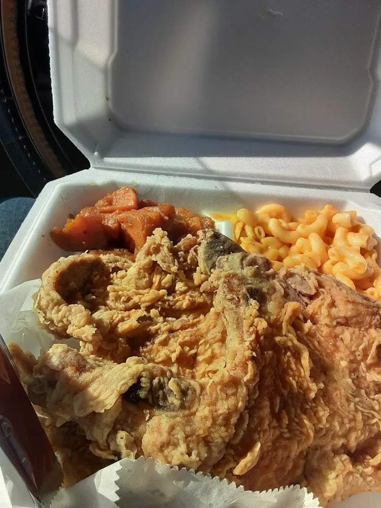 Two Fried Pork Chops with Mac and Cheese and Candied Yams